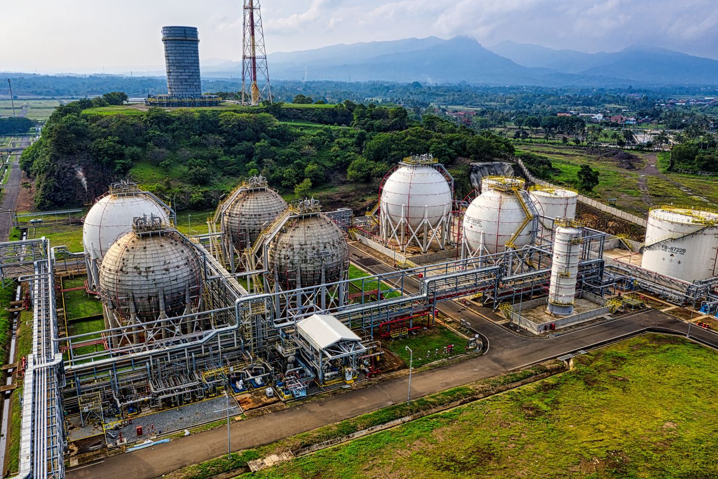 Industrial storage tanks at a green hydrogen and ammonia facility